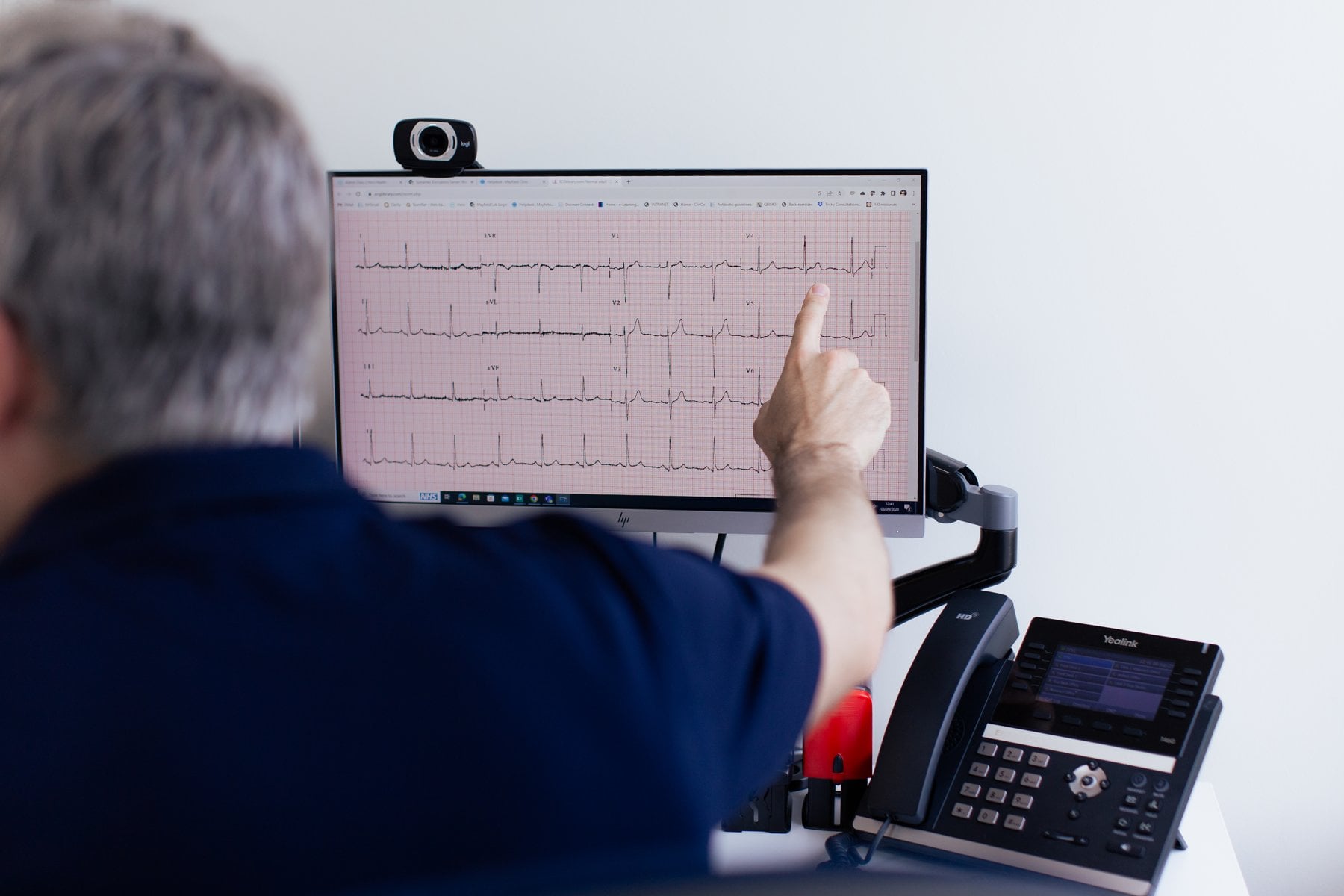 A Mayfield Clinic GP reviewing an ECG trace